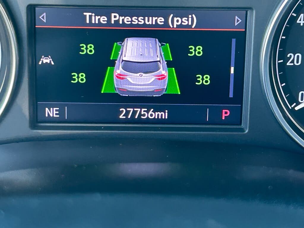 28 Center dashboard display showing tire pressures of 38 psi for all four tires with a car icon and the odometer reading 27,756 miles.